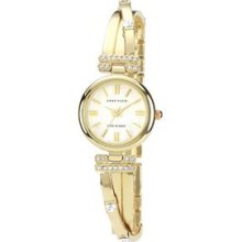 Anne Klein Women`s Gold Tone Swarovski Crystal Accented Bangle Watch