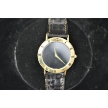 Retro Mens Gucci Wristwatch With Black Dial Keeping Time