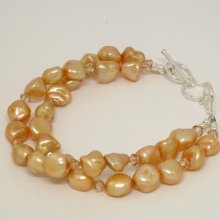 Fresh water pearls and Swarovski double strand bracelet. approx. 9mm fresh water pearls - 7 Â¼ to 8 Â¼ inch adjustable. Sterling silver clasp. SKU:2062