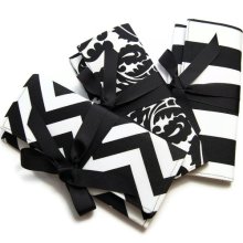 Black and white bridesmaid clutches with black ribbon. Custom colors available.