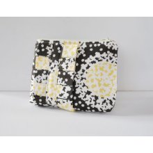 Cosmetics make up bag : made with abstract flowers in yellow,white and brown fabric with a ruffle.