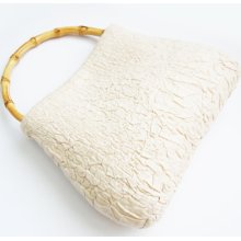 Felted handbag with bamboo handle.