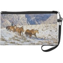 Horse Drive Through the Snow Wristlet Clutches