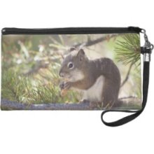 Squirrel eating a pine cone 2 Wristlet Clutch