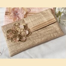 wedding clutch bag in quilted silk with flower corsage - 'Evelyn' design, available in almond, sugar pink, pistachio or violet